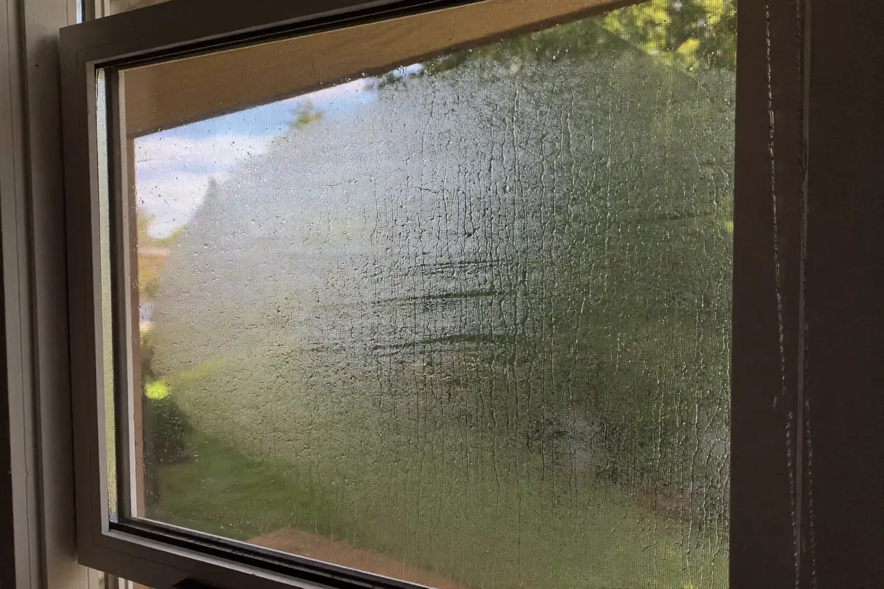 Morning condensation on the inside of a window pane