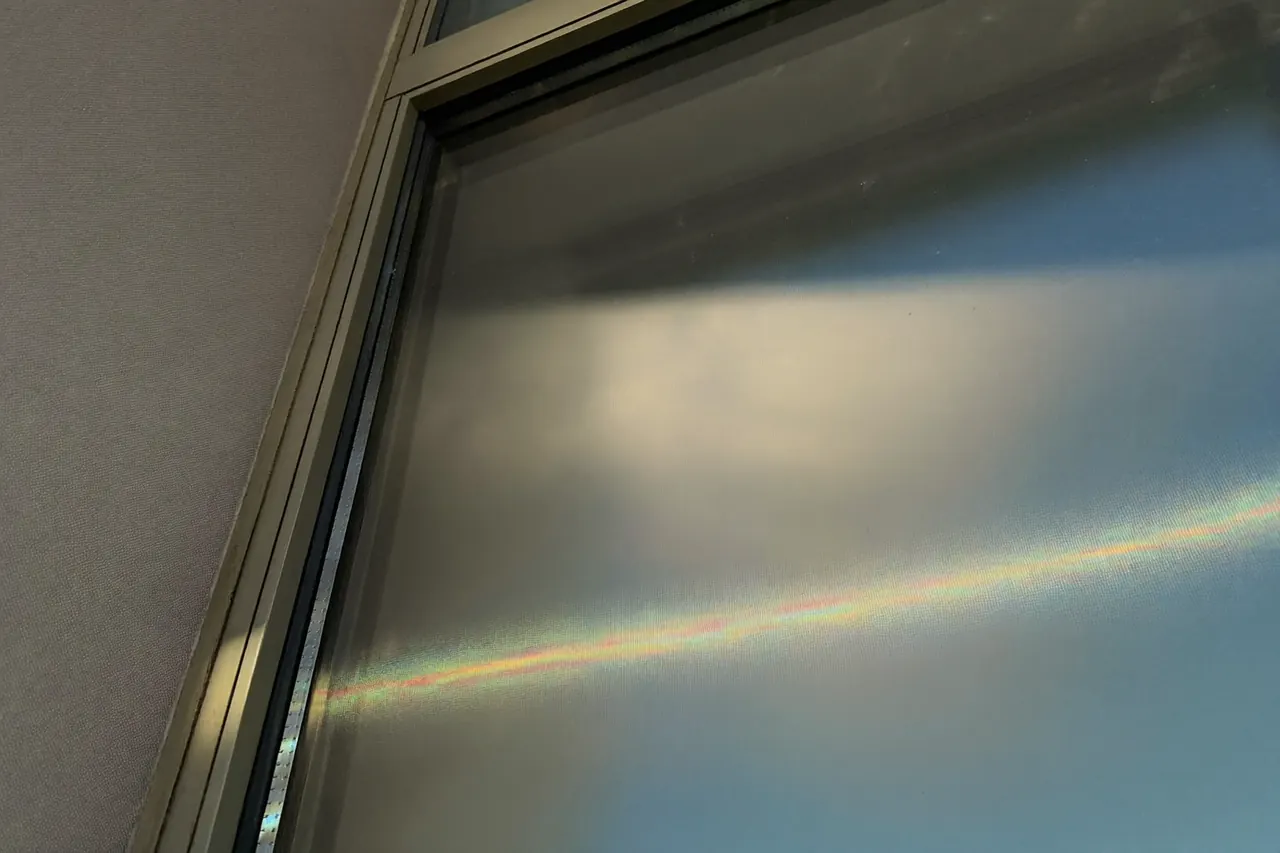 Close detail of low-emissivity coated window glass