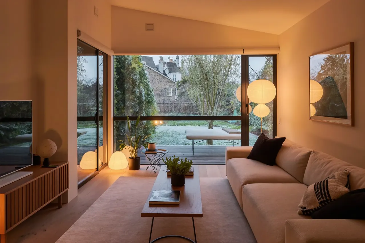 Warm UK living room with large windows in winter